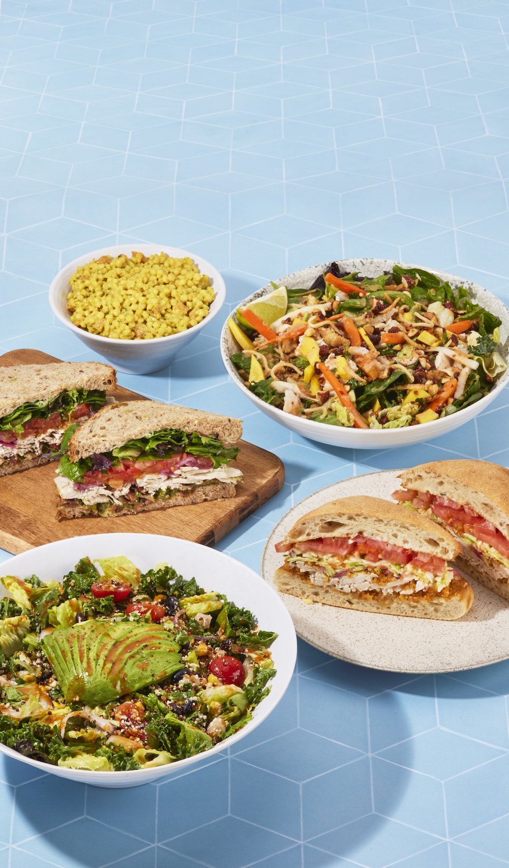 Sandwiches and salads with greens and corn